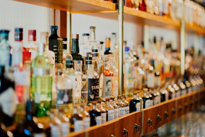 Various kinds of liquor on the wooden shelves