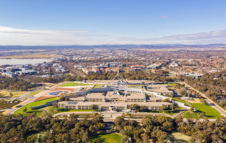 “Aerial view of Australia’s Parliament House in Canberra, symbolising national policy and government decision-making.”